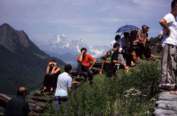 photo of Republic of Georgia, Svaneti, village of Kala, along the stairs up to the church of saint Kvirike, with in the background the twin peaks of the Caucasus mount Ushba (4710 m)