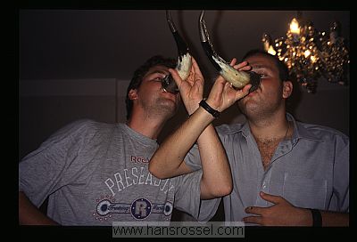 photo of Georgia, drinking wine out of wine horns, Hans Rossel