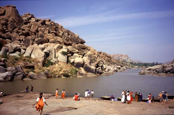 photo of India, Karnataka, Indian school children near a river close to Hampi