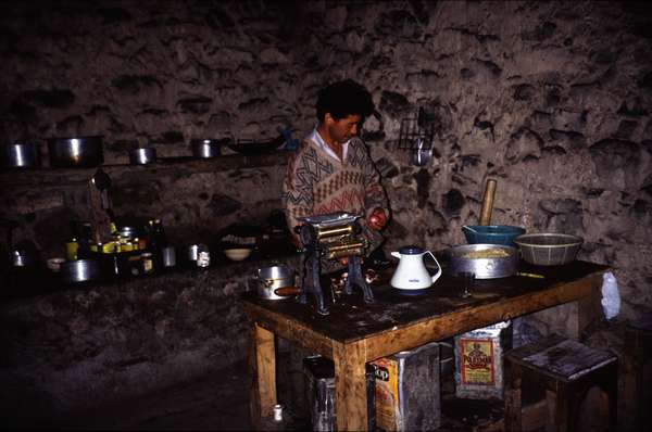 photo of India, Ladakh, construction workers campsite kitchen next to a buddhist temple