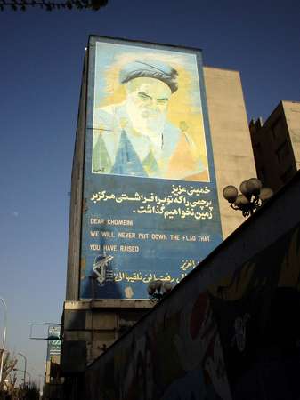 photo of Iran, Esfahan, propaganda billboard of the Iranian revolution : 'dear Khomeini, we will never put down the flag that you have raised