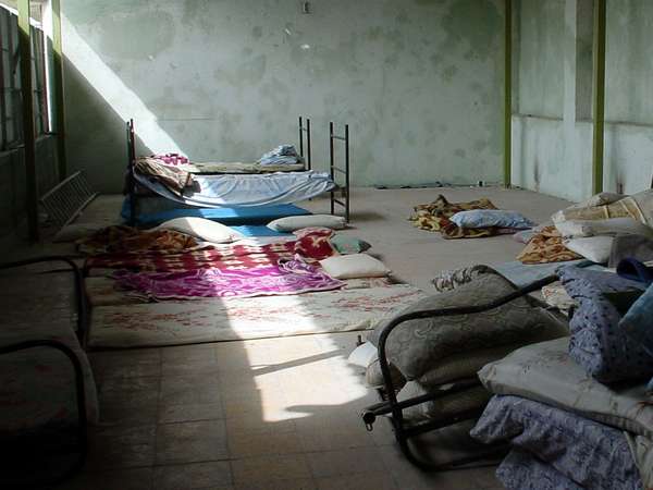 photo of Iran, beds, sheets and blankets in a hotel room in Bandar Abbas