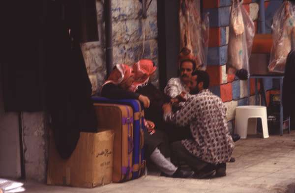 photo of Jordan, Kerak, Jordanian men waiting for the bus