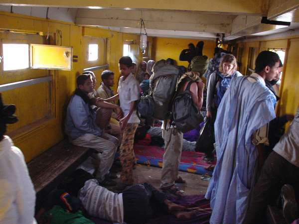 photo of Mauritania, Nouadhibou - Choum, the only passenger carriage on the long (2 km and around 200 wagons) iron ore train, as there were tiny windows, no light and more than one hundred people inside, it was quite a rough ride