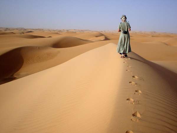 photo of Mauritania, desert around Chinguetti, walking on top of the sand dunes