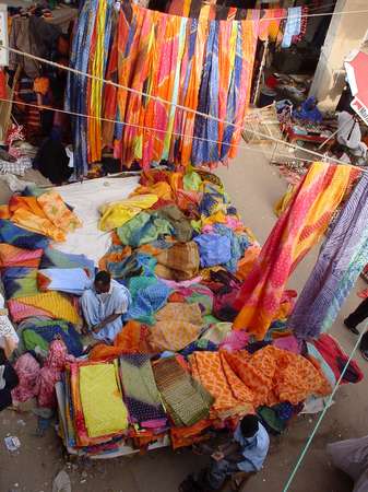 photo of Mauritania, Nouakchott, selling colorful batik fabric on the central market