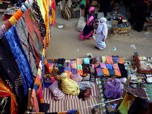 photo of Mauritania, Nouakchott, selling colorful batik fabric on the central market