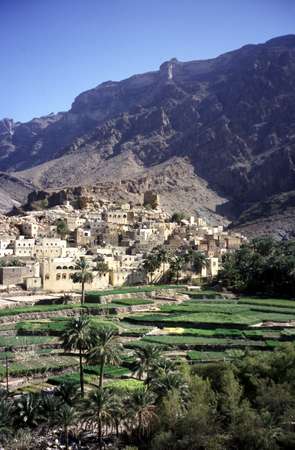 photo of Oman, around Al Rostaq, Bilad Sayt (bilad sait) mountain village, a scenic oasis settlement with stone-and-mud dwellings with the Jebal Shams mountains behind