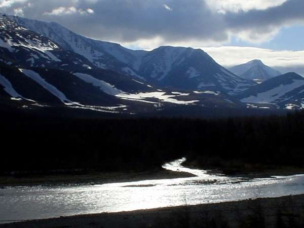 photo of Northern Russia, crossing the snowy Arctic Ural mountains in June, view from the train from Vorkuta to Labytnangi (Salekhard)