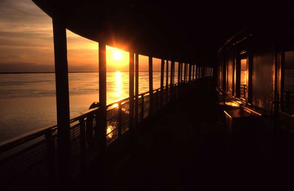 photo of Russia, Siberia, river ferry and sunset above the river Ob