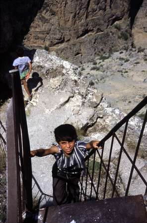 photo of Turkey, around Kars, boy climbing up stairs