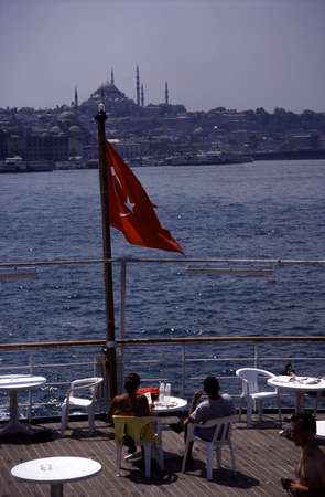 photo of Turkey, Istanbul, the Bosphorus, the city centre and a Turkish flag