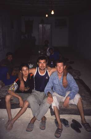 photo of Turkmenistan, around Darvaza, Turkmen truck drivers in a desert chaihana (tea house)