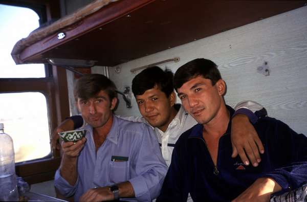 photo of Turkmenistan, Turkmen man drinking tea on the train from Ashgabat to Turkmenbashi