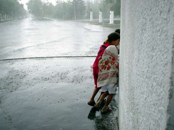photo of Tuva, Kyzyl park, children hiding for the rain