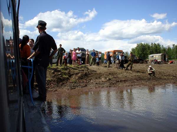 photo of Tuva, on the Yenisey (Yenisei) river, Tuvan villagers waiting on the river bank as the ferry boat from Kyzyl to Toora Chem (Toora-Xem, Toora-Khem) is mooring