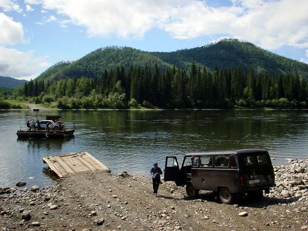 photo of Tuva, taiga forest east of Kyzyl, wooden car ferry to Erzey, a village of Russian Old Believers, people forced to move to very remote areas of Russia and Siberia because they rejected the Russian Orthodox Church reforms of 1652