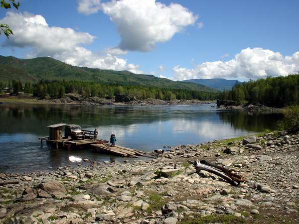 photo of Tuva, taiga forest east of Kyzyl, wooden car ferry to Erzey, a very isolated village of Russian Old Believers, who still retain their old customs and traditions, marry within their group and are lumbermen or fur traders