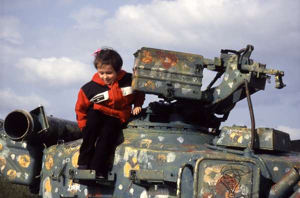 photo of Ukraine, Kiev, Shevchenko park, girl on tank with graffiti