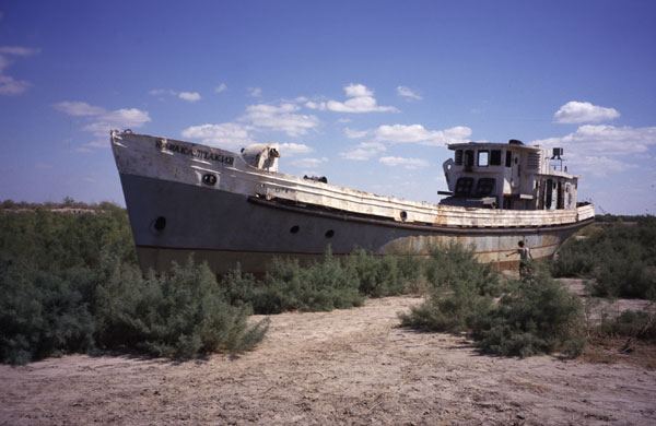 photo of Uzbekistan, around Moynaq (Moynak, Muynak), a former fishing village on the shores of the Aral Sea, shipwreck of an abandoned boat on the dry bottom of the Aral lake, once the 4th biggest lake in the world, now an environmental disaster