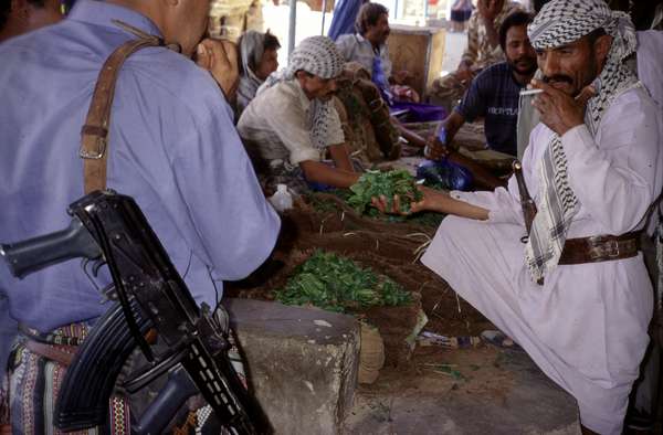 photo of Yemen, qat (khat, kat) market. Fresh leaves of the catha edulis, are a stimulant similar to d-amphetamine. Khat is very popular among Yemeni and was used in Yemen even before coffee, producing a feeling of exaltation and a feeling of being liberated from space and time