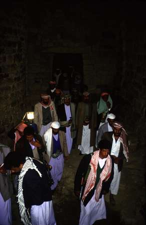 photo of Northern Yemen highlands, tiny village in the Hajar mountains, family members during a night ceremony of a wedding celebration