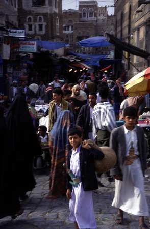 photo of Yemen, men with traditional jambia (djambia) daggers in a market street in Old Sanaa