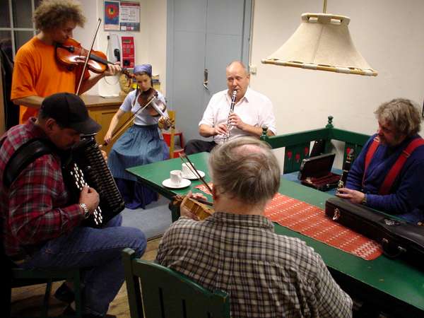 photo of Sweden, playing traditional Swedish music with violin and flute in Folkmusikhus Skeppsholmsg&aring;rden, a great place where local folkartists meet up on sunday evenings and in a very relaxed atmosphere play together, sometimes there are free folk dance courses on live music; Sweden Swedish Sverige Zweden Suede