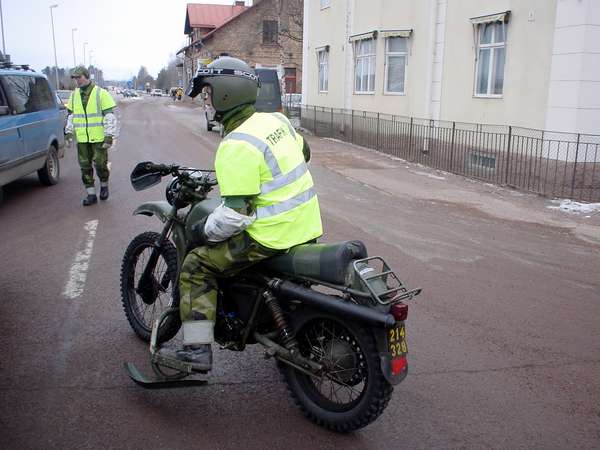 photo of Sweden, Mora, Police motorbike with skis next to the wheels as extra stability on the slippery Swedish winter roads