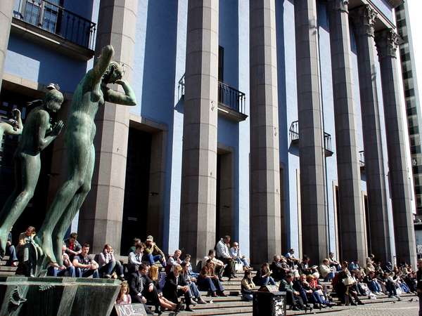 photo of Sweden, Stockholm, people eating their lunch on the stairs in front of the Konserthuset on Hötorget square in the centre of Stockholm