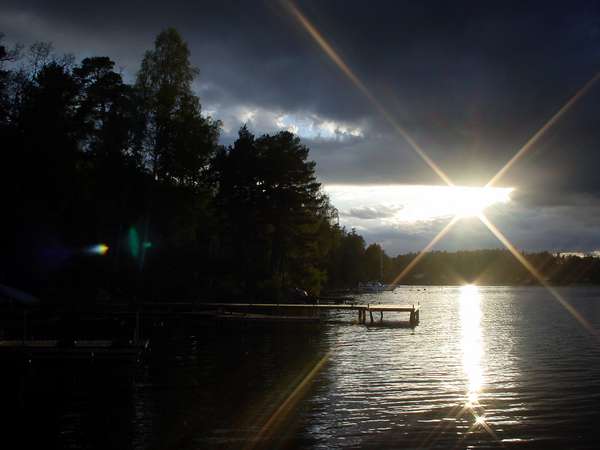 photo of Sweden, Stockholm area, view of sunset above lake Mälaren from the tiny island of Kanan with in the background the island of Ekerö