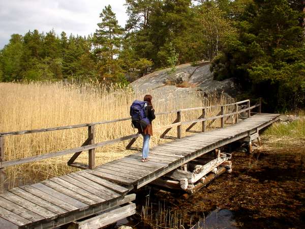 photo of Sweden, around Stockholm, crossing a wooden bridge on the rocky island of Finnhamn, one of the 24000 islands in the Stockholm Archipelago (skärg&Aring;rd)