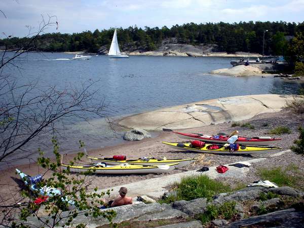 photo of Sweden, around Stockholm, canoes of people on a long distance canoe trip on the rocky island of Finnhamn, one of the 24000 islands in the Stockholm Archipelago (skärg&Aring;rd)