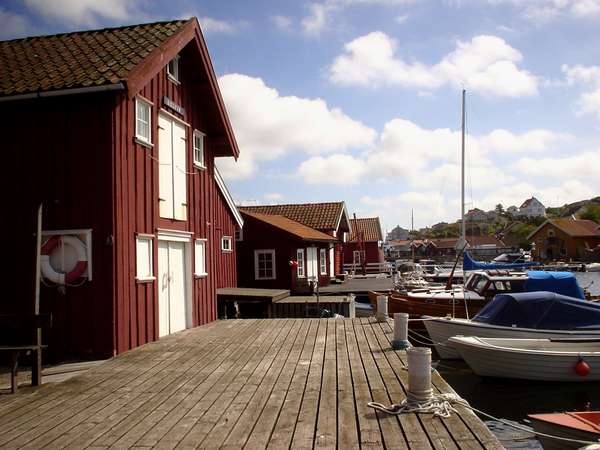 photo of Sweden, West Coast, Göteborg (Gothenburg) archipelago, red houses and boats on the island of Gullholmen