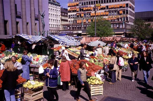 photo of Sweden, Stockholm, fruit seller on the Hötorget Market in central Stockholm. Most of the marketpeople are immigrants which will try to catch your attention with funny oneliners in a cosy kind of Swedish 