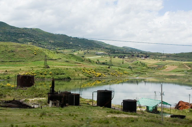 Albania photo around Fieri: Oil derrick, Petrol industry, Albanian Oil field. Albanian Ecology, environment, waste and pollution. 