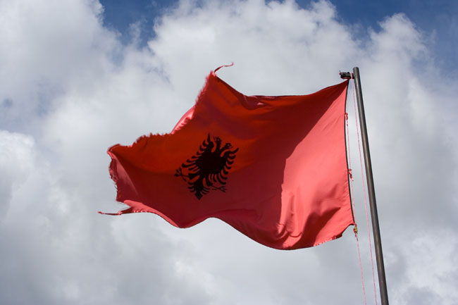 Albanian flag of Albania with clouds 