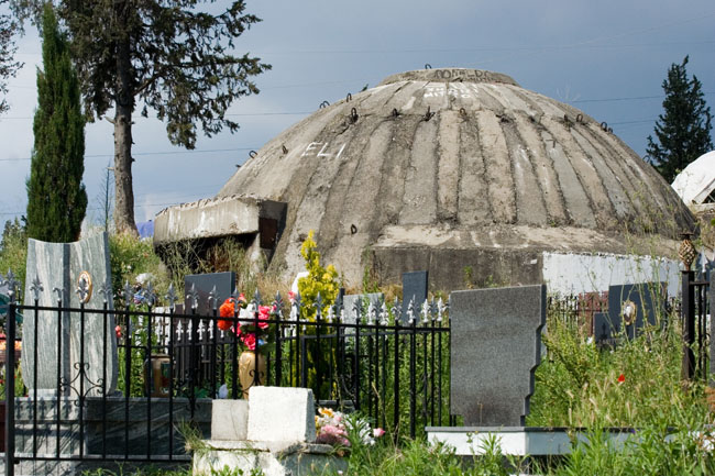 Albania photo Tirana main cemetery : Communist era defensive Albanian bunker. Concrete dome shelter built during Enver Hoxha's rule all over Albania as protection against a foreign invasion. Varreza e Sharrës cemetery. 